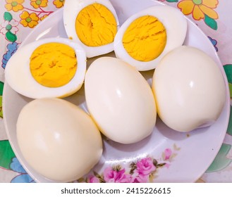 Egg boiled,Hard-boiled egg, Hard-boiled eggs on plate, Eggs,Hard boiled eggs, sliced in halves on plate,Egg. - Powered by Shutterstock