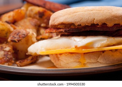 An Egg Cheese And Bacon Breakfast Sandwich With Hashbrowns