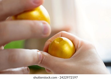 Egg cracked in an Orthodox Easter traditional custom - Powered by Shutterstock