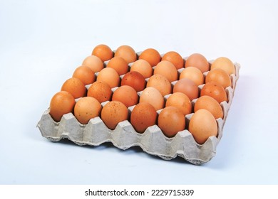 Egg in an egg crate on white background - Shutterstock ID 2229715339