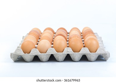 Egg In An Egg Crate On White Background