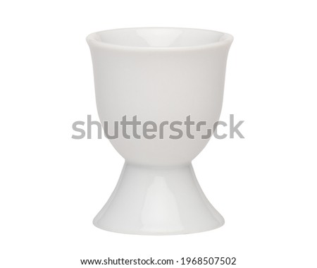 Egg cup. Empty ceramic eggcup for breakfast. Holder stand for boiled chicken eggs on white isolated background.
