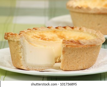 Egg Custard Tart On A Green Table Cloth