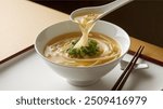 Egg Drop Soup: A Chinese soup featuring silky strands of beaten eggs in a light, flavorful broth, often garnished with green onions and sometimes tofu or corn for added texture