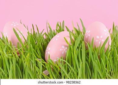 egg easter in a grass on lilac background
