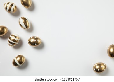 Egg Hunt Is Coming. Easter Traditions, Golden Colored Eggs On White Background, Top View, Copyspace For Your Ad Or Greetings. Concept Of Holidays, Spring, Celebrating, Food And Sweets, Family Time.