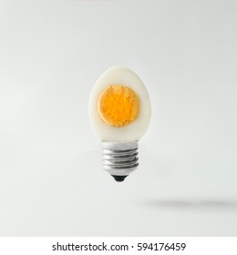 Egg lightbulb on bright background. Idea concept.