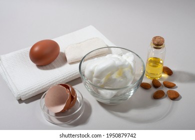 Egg White Face Mask Ingredients. Whipped Egg White And Almond Oil.