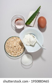 Egg White Face Mask Ingredients. Whipped Egg White, Aloe, Sugar, Oatmeal. Vertical, Top View.