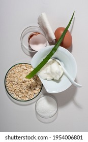 Egg White Face Mask Ingredients. Whipped Egg White, Aloe, Sugar, Oatmeal. Vertical, Top View.