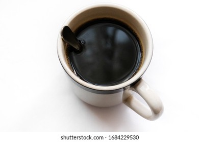 Egg Nog Cup Of Black Coffee On A White Background.