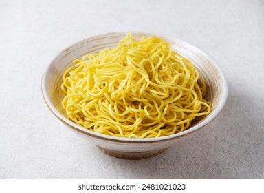 Egg Noodles In a white bowl with a pattern On a clean white background