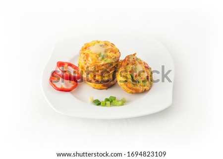Egg omelet muffins on the withe dish. Ideal for breakfast. 