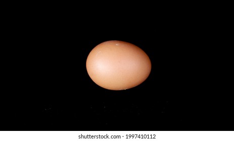 an egg on a black background