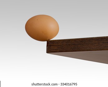 Egg On The Edge. Fine Balance, Tipping Point Etc. Risk, Danger Concept Or Metaphor.