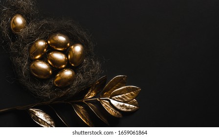 
The egg is painted gold in a straw nest and the plant with golden leaves on a black background with a view from above.A background for celebrating Easter. Top view,Flatlay. - Powered by Shutterstock