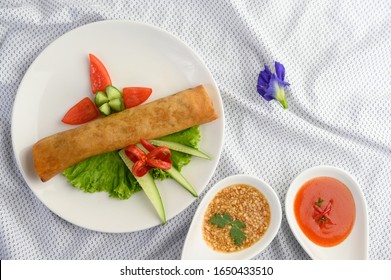 Egg Roll Or Fried Spring Rolls On The White Plate Thai Food. Top View.