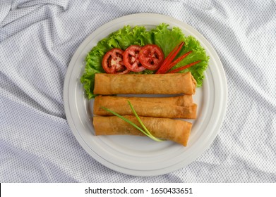 Egg Roll Or Fried Spring Rolls On The White Plate Thai Food. Top View.