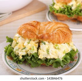 Egg Salad And Lettuce Sandwich On A Croissant Roll