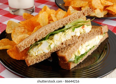 An Egg Salad Sandwich And Chips