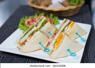 Egg Salad Sandwich On White Dish