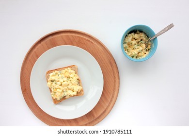 Egg Salad Sandwich With Whole Wheat Toasted Bread And Microgreens On Plate On White Background. Healthy Food Concept. Top View, Selective Focus