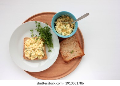 Egg Salad Sandwich With Whole Wheat Toasted Bread And Microgreens On Plate On White Background. Healthy Food Concept. Top View, Selective Focus