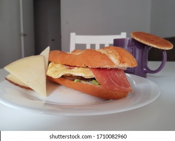 Egg, Serrano Ham, Avocado Sandwich With Manchego Cheese, Tea And Eastern Honey Biscuit