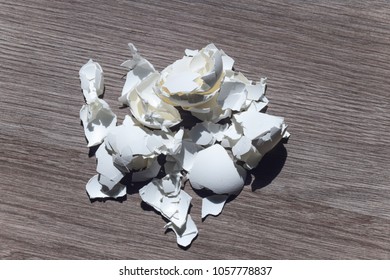 Egg Shell On The Table. Calcium Carbonate, Found Naturally In The Form Of Minerals, Is Part Of The Egg Shell. Used In Everyday Life To Alkalize The Soil In Gardening.