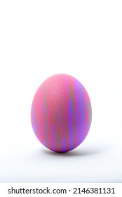 Egg Standing Upright On A White Background. Closeup Of Egg Shell Texture.