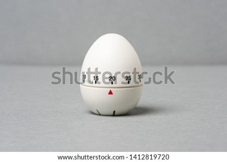Egg timer  on grey background.