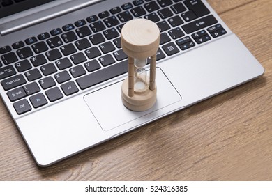 Egg Timer On An Open Laptop Keyboard In A High Angle View Conceptual Of Measurement Of Time And Countdown To A Deadline