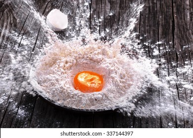 Egg Yolk Fell Into A Clay Bowl With Flour