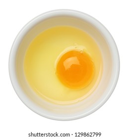 Egg Yolk And White In A Bowl Isolated On White