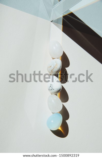 Egg-formed variation of stones with a prism under a\
hard light p