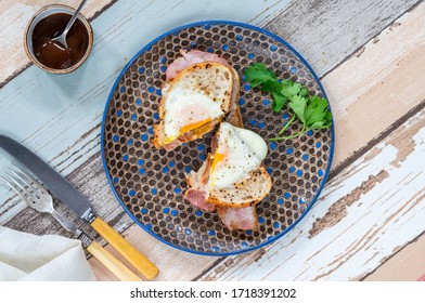 Egg-in-the-hole Bacon Sandwich Cut In Half - Overhead View