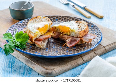 Egg-in-the-hole Bacon Sandwich Cut In Half