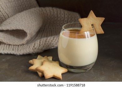 Eggnog Cocktail And Star Cookies On Black Background.
