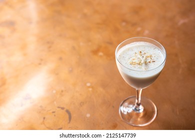 Eggnog Rum Cocktail With Toasted Coconut And Nutmeg