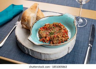 eggplant caviar on plate. serving food in a restaurant