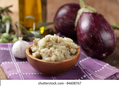 Eggplant caviar in the wooden bowl