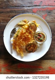 Eggplant And Fried Eggs With Rice And Kapi Chili Paste. Local Thai Food Is In A Zinc Plate Placed On An Old Wooden Table.