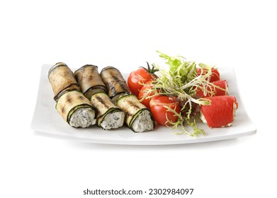Eggplant rolls, rolls of baked pepper stuffed with cheese and sour cream. With tomatoes and herbs. Isolated on a white background - Powered by Shutterstock