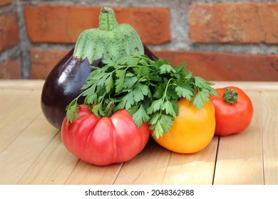 Eggplant, tomatoes and parsley on a wall background. Organic vegetables.. - Powered by Shutterstock