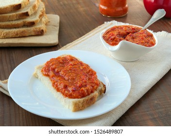 Eggplant vegetable caviar spread on a slice of bread over white plate