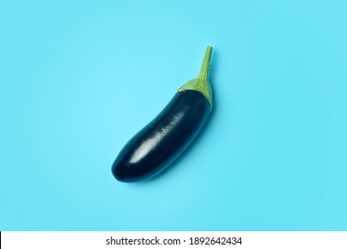 Eggplant Vegetable On A Blue Minimal Background. Vegetables And Food Minimal Concept.