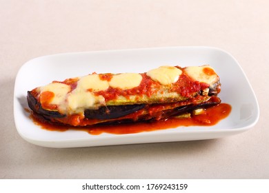 Eggplant and zucchini lasagna with mozzarella on top, served