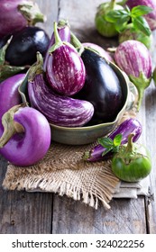 Eggplants of different color and variety on the table