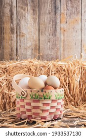 Eggs in basket in a barn with hay