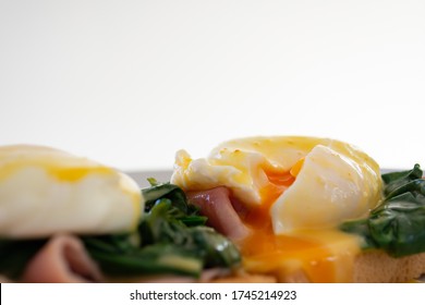 Eggs Benedict Brunch With Spinach And Ham, With A Runny Egg Yolk